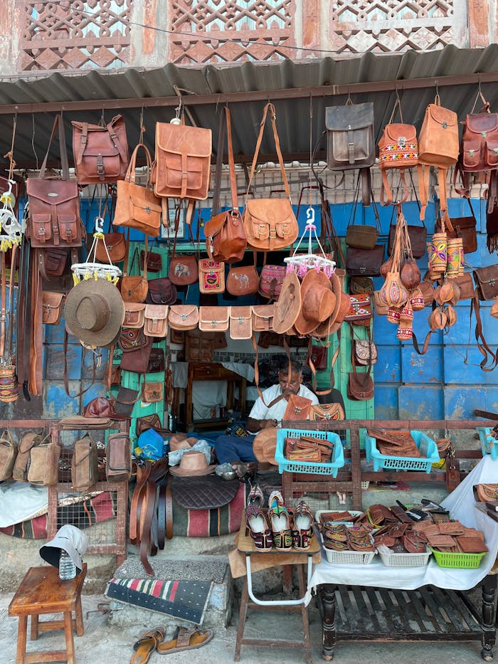 A vibrant display of leather goods at a traditional shop in Jodhpur, India.